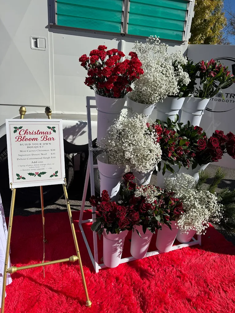 Christmas Bloom Bar with red carnations, baby's breath and roses on red rug