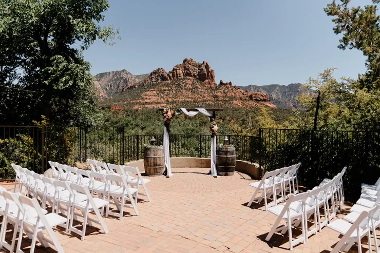 Sedona overlook wedding ceremony with whiskey barrel altar